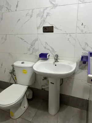 a bathroom with a toilet and a sink at Riad ezzaytoune 2 in Meknès