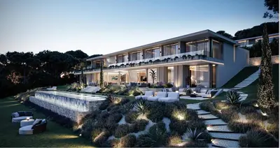 a house with a garden with white furniture in front of it at Villa matudi in Timsernit