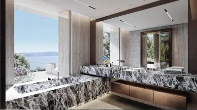 a bathroom with two sinks and a large mirror at Villa matudi in Timsernit