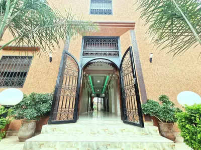 an entrance to a building with an open gate at Hotel&Restaurant Atlas Symphony in Ourika