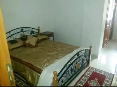 a bedroom with a bed in a room at Apparemment Mehdi in Fès