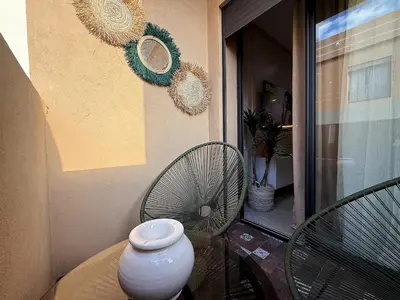 a vase sitting on a table on a balcony at New appart moderne à Gueliz , charme et confort in Oulad Akkou