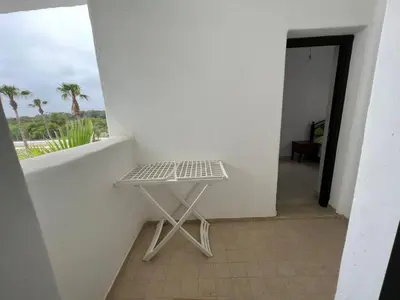 a small white table in a room with a window at كابو نيكرو in Oulad Akkou