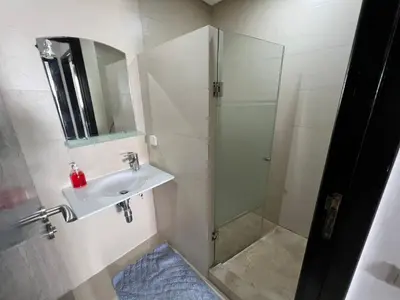 a bathroom with a shower and a sink at كابو نيكرو in Oulad Akkou