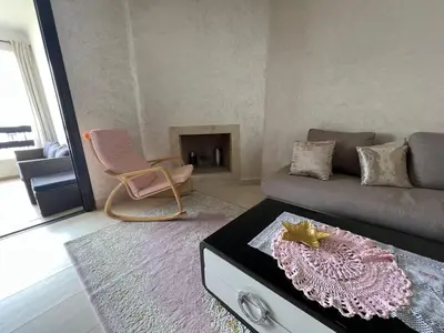 a living room with a couch and a table at كابو نيكرو in Oulad Akkou