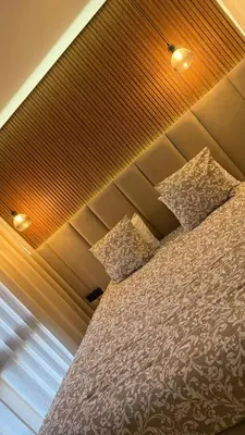 a bedroom with a bed and a window at appartement Golf Prestigia 3 chambres in Oulad Akkou