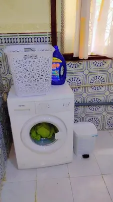 a white washing machine in a bathroom at appartement Tanger in Oulad Akkou