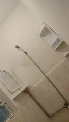 a bathroom with a white toilet in a room at appartement Tanger in Oulad Akkou