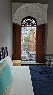 a bedroom with a window and a bed and a bed sidx sidx sidx at Riad Dar Bahija Fes in Fès
