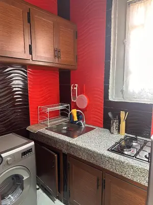 a kitchen with a sink and a washing machine at Dar Kenza in Fès