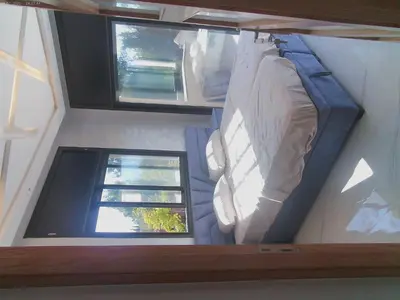 a small room with a bed and a window at Villa Ghmat in Aït Ali Ou Allah