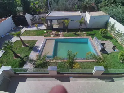 an aerial view of a backyard with a swimming pool at Villa Ghmat in Aït Ali Ou Allah