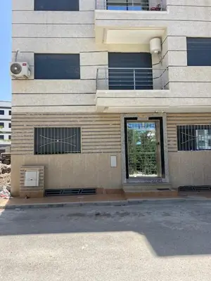 a building with a window on the side of it at Maison in Oulad Akkou