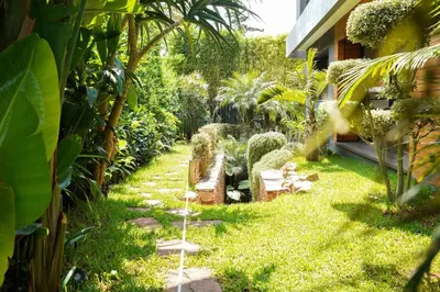a garden with cacti and plants in a house at The Classic Affair For Car Lovers in Oulad Akkou