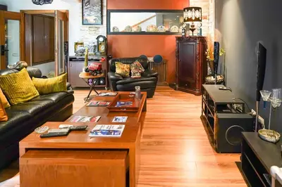a living room with a couch and a coffee table at The Classic Affair For Car Lovers in Oulad Akkou