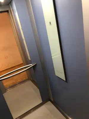 a door with a mirror on the side of a room at Appartement Nour sakane targa kech in Oulad Akkou