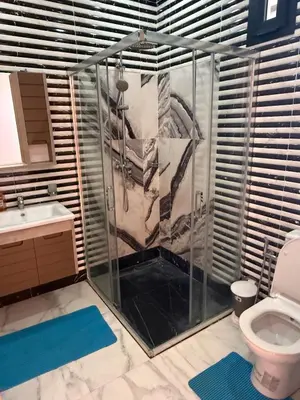 a bathroom with a shower and a toilet at Villa Denalya in Marrakech