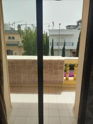 a view from an open window of a balcony at No21 Loulan Villa21\u53f7\u522b\u5885\u6c11\u5bbf in Oulad Akkou