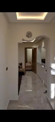 a living room with a hallway with a ceiling at diki ksar sghir in Oulad Akkou