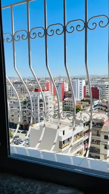 a view of a city from a window at Appartement de luxe à louer à la journée à Tanger Au centre ville in Fès