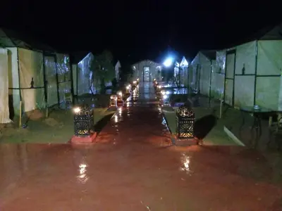 a row of lights on a street at night at Villasaharamerzouga in Merzouga