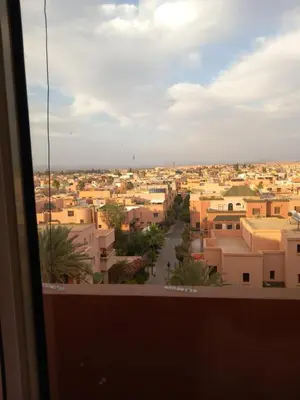 a view of a city from a window at Al boustane1 in Oulad Akkou