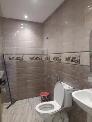 a bathroom with a toilet and a sink at diki in Oulad Akkou