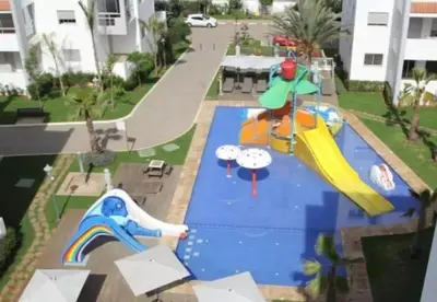 an image of a playground with a slide at La siesta beach resort in Oulad Akkou