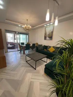 a living room with a couch and a table at La siesta beach resort in Oulad Akkou