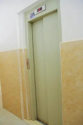 a bathroom door with a sign on top of it at Appartement du luxe in Oulad Akkou