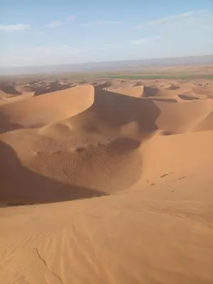 a desert view of sand dunes in the desert at قصر الركابي in Mhamid