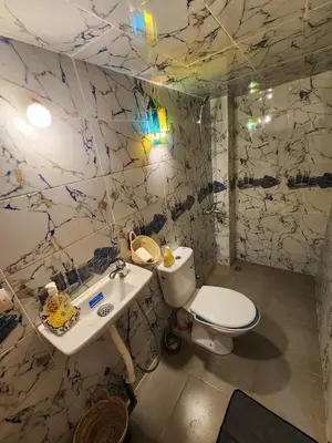 a bathroom with a toilet and a sink at Riad Bennouna in Fès