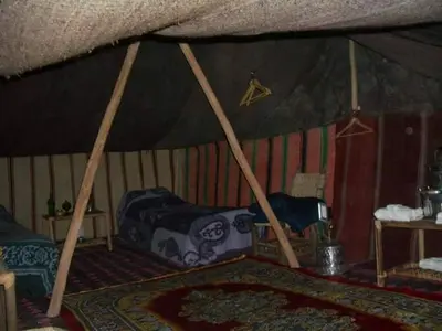 a room with a bed in a tent at Campement Akka Nait Sidi - Tissint in Tissint