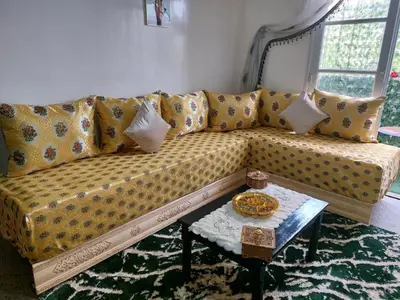 a couch with pillows and a table in a living room at 2bedroom Apartments in Downtown in Fès