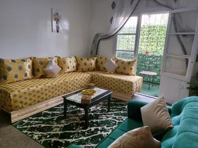 a living room with a couch and a table at 2bedroom Apartments in Downtown in Fès