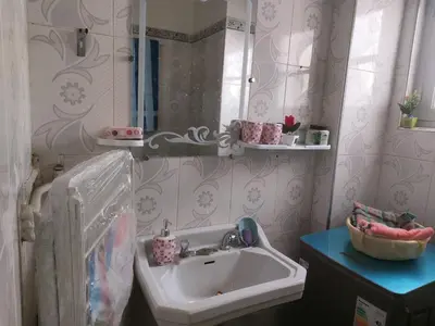 a bathroom with a sink and a mirror at 2bedroom Apartments in Downtown in Fès