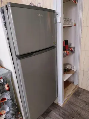 a refrigerator with its door open in a kitchen at 2bedroom Apartments in Downtown in Fès