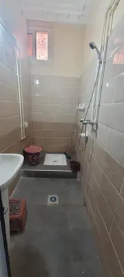 a bathroom with a shower and a sink at faouzi walid in Er Rachidia