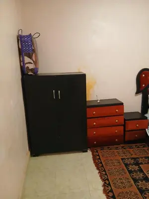 a room with a black cabinet and a dresser at house Merinides fes in Fès