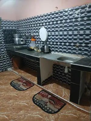 a kitchen with a counter and a sink in a room at house Merinides fes in Fès