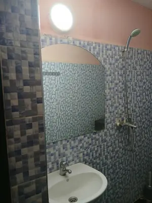 a bathroom with a sink and a mirror at house Merinides fes in Fès