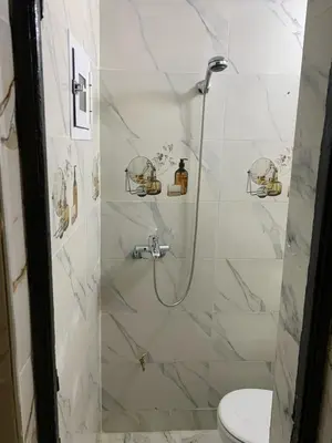 a bathroom with a shower with a toilet at chez saad in Fès