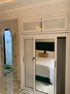 a bedroom with a cupboard with a bed in it at chez saad in Fès