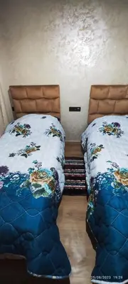 a bedroom with two twin beds next to each other at Appartement agadir bay bien ensoleillé in Oulad Akkou
