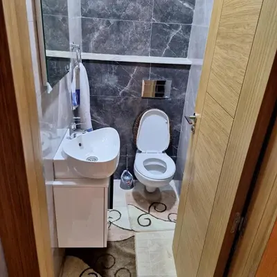 a small bathroom with a toilet and a sink at Appartement agadir bay bien ensoleillé in Oulad Akkou