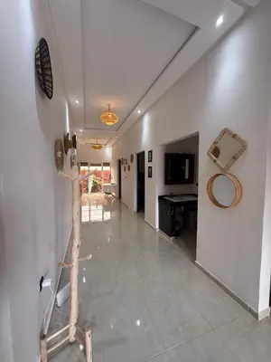 a hallway with a room with a mirror and a table at Dar Sofilal à Marrakech