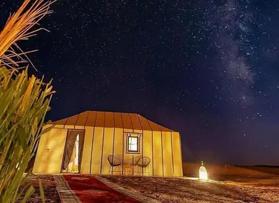 a small house with a starry sky at night at Fantastic desert camp in Oulad Akkou
