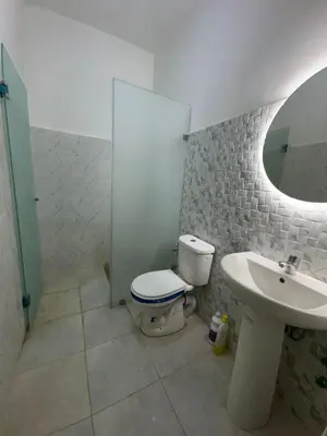 a bathroom with a toilet and a sink at Appartement in Fès