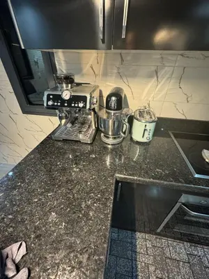 a kitchen counter with a blender and pots and pans at Maison Privée avec Sauna Marrakech in Chouiter