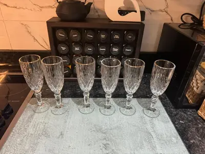 a group of wine glasses sitting on a counter at Maison Privée avec Sauna Marrakech in Chouiter